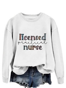 Detail of Licensed Practical Nurse print on white long sleeve sweatshirt and denim shorts