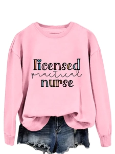 Detail of pink licensed practical nurse sweatshirt with colored typography on white backdrop