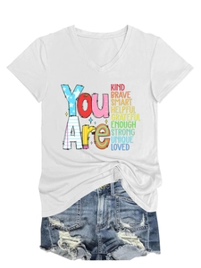 Close-up of V-neck white T-shirt with inspirational text and knotted hem detail