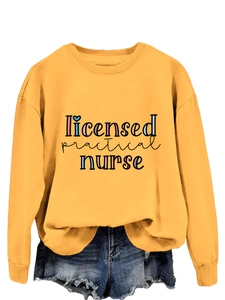 Detail of Licensed Practical Nurse print on mustard yellow crewneck sweatshirt