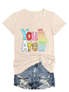 Detail of V-neck cotton T-shirt with positive text and frayed denim shorts set