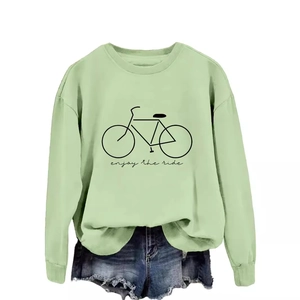 Enjoy the ride mint green sweatshirt with bicycle print paired with denim shorts