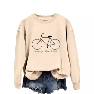 Beige crewneck sweatshirt with 'Enjoy the ride' bicycle print and denim shorts