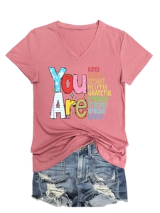 Detail of pink V-neck T-shirt featuring You Are Kind Brave Smart inspirational text
