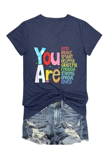 Detail view of V-neck navy T-shirt with You Are Kind Brave Smart rainbow text print