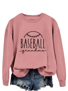 Detail of pink Baseball Grandma sweatshirt featuring printed lettering and denim shorts