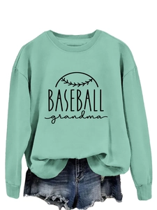 Detail of mint green Baseball Grandma sweatshirt paired with denim shorts