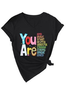 Detail of V-neck black T-shirt with inspirational print and stylish front knot hem
