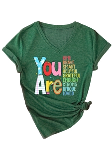 Detail of dark green V-neck T-shirt with twisted knot hem and inspirational lettering