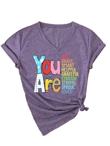 Close-up of women's purple V-neck T-shirt with inspirational print and knot detail