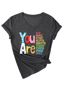 Detail of dark grey V-neck T-shirt featuring You Are Kind Brave Smart artistic print