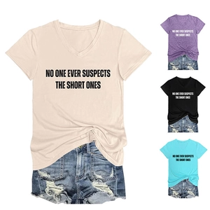 Detailed flat lay of V-neck slogan t-shirts in multiple colors with denim shorts