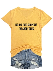 Detail of V-neck yellow cotton T-shirt featuring NO ONE EVER SUSPECTS THE SHORT ONES print