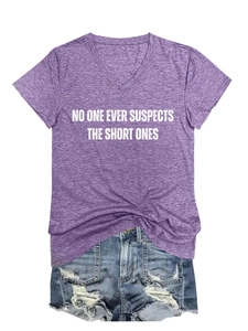 Flat lay of purple V-neck T-shirt with white slogan and distressed denim shorts