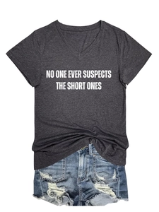 Flat lay of V-neck T-shirt with SHORT ONES slogan and ripped denim shorts