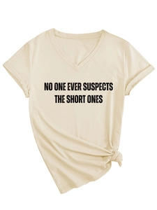 Detail of beige V-neck T-shirt with black text slogan and decorative side knot at the hem