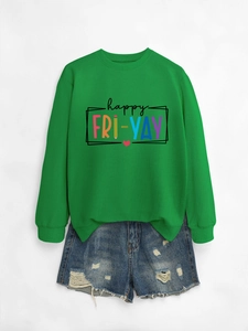 Detail of happy fri-yay letter print on green crewneck sweatshirt and ripped denim shorts