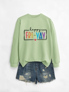 Detail of happy fri-yay print on mint green sweatshirt with distressed denim shorts