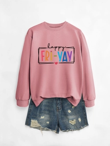 Close-up of Happy Fri-Yay letter print on pink sweatshirt with denim shorts outfit
