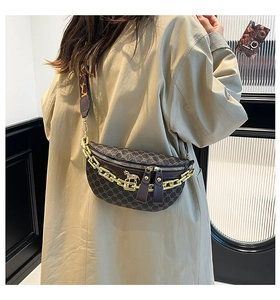 Detail of vintage monogram crossbody bag with gold horse buckle and chunky chain