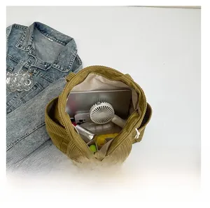 Interior view of mustard green corduroy tote bag showing large capacity for essentials