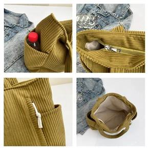 Detail view of corduroy tote bag featuring side pockets and woven lace trim decoration