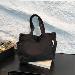 Large capacity black corduroy tote bag for women showing spacious side pocket design