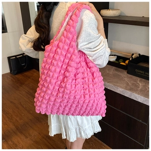 Detailed back view of pink bubble texture tote bag with wide shoulder strap