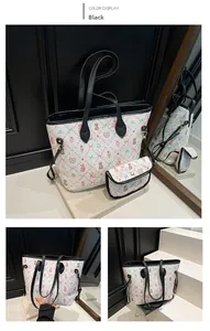 Detail view of the printed tote bag with cartoon bears and matching mini pouch set