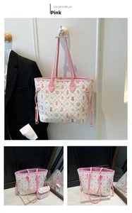 Detail view of pink strap tote bag with cute animal prints and side drawstring accents