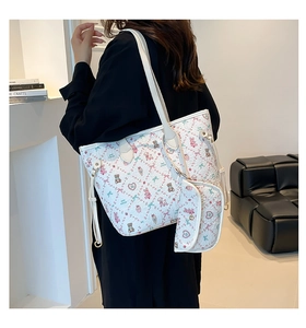 Detail showing sweet cartoon print with bear and bow patterns on white tote bag