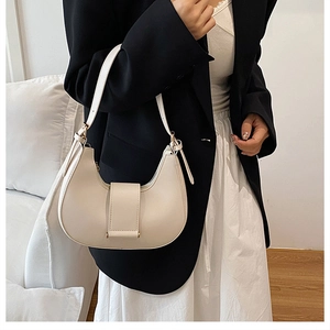 French retro creamy white leather crescent bag with belt buckle detail and slim strap