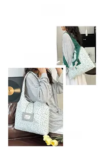 Close-up of floral tote bag with green plaid strap and decorative checkered pocket detail
