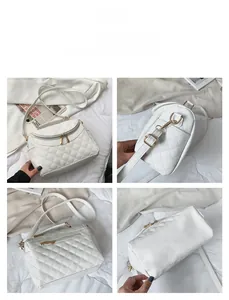 Detail view of white quilted PU leather bag showing zippers, hooks and stitching texture