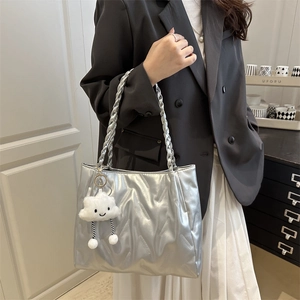 Silver embossed tote bag with woven handles and cute white cloud pendant detail