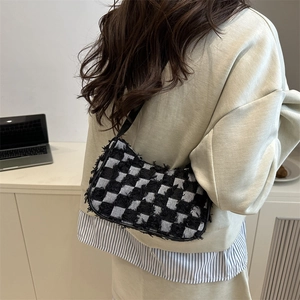 Retro black and white checkerboard baguette bag with premium woven fabric texture