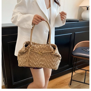Detail of plush tote bag with sherpa texture and premium leather strap in khaki color