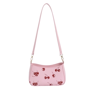 Pink shoulder bag with cherry print, synthetic leather material and gold hardware accents