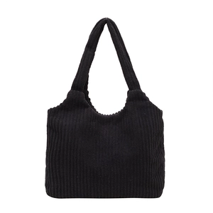 Minimalist black corduroy tote bag with thick ribbed texture and large capacity