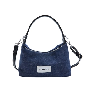 Retro dark blue denim dumpling bag with leather handle and adjustable shoulder strap