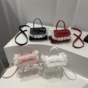 Mini sweet lace handbags with bow decoration in four colors on geometric stands