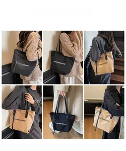 Vues détaillées du grand sac cabas en toile montrant l'ajustement et le style sur un mannequin