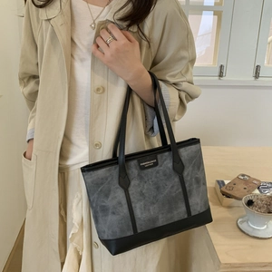 Minimalist vintage grey suede tote bag with black leather straps for women's daily commute