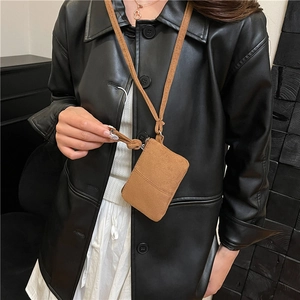 Mini brown suede neck pouch with zipper closure and adjustable lanyard for small items