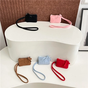 Mini crossbody neck pouches in five colors made of premium matte suede with wrist straps