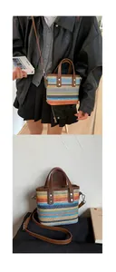 Détail d'un sac seau tressé arc-en-ciel avec anses en cuir et rayures colorées