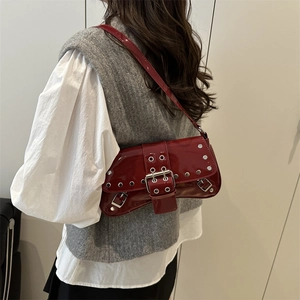 Red glossy patent leather underarm bag with silver studs and metal buckle for women