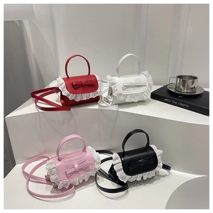 Mini lace-trimmed crossbody bag set in red, white, pink and black on minimalist steps