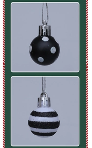 Detail of black matte with silver dots and white striped Christmas ball ornaments