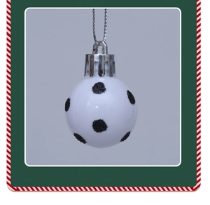 Detail of white Christmas ball ornament with black glitter dots and silver hanging string